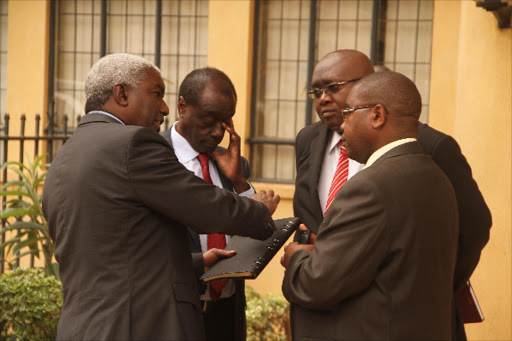 DEFENCE TEAM: Former PS Thuita Mwangi with his lawyers Paul Muite, Muturi Mwangi and Wilfred Nderitu at the Milimani law courts on May 20 2014. He has denied criminal charges in the Tokyo embassy scandal.Photo/Philip Kamakya