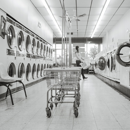 Singular Launderette & Dry Cleaners logo