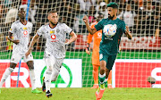 Miguel Timm of Orlando Pirates challenges AmaZulu's Abbubaker Mobara in the MTN8 final at Moses Mabhida Stadium in Durban on November 5 2022.