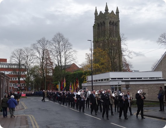 The parade passes close to Christ Church Tower