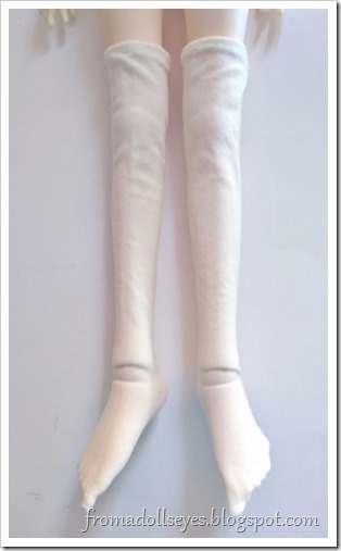 How to make ball jointed doll socks.  Turn the socks right side out, then try on the doll.