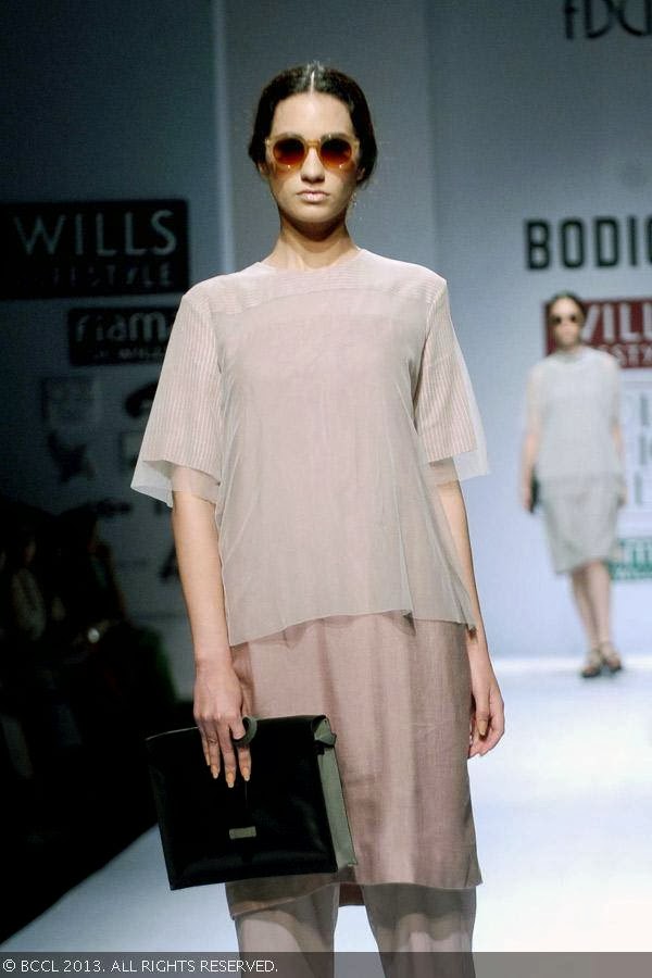 A model showcases a creation by fashion designer Ruchika Sachdev on Day 3 of Wills Lifestyle India Fashion Week (WIFW) Spring/Summer 2014, held in Delhi.