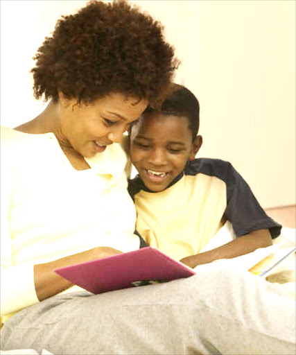 Mother and child read a book