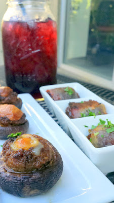 Pink Rose Restaurant happy hour option of the Chorizo Stuffed Mushrooms with Painted Hills beef house chorizo and Manchego cheese, plus Bacon wrapped Dates with Medjool stuffed dates, toasted almonds, Rogue blue cheese to accompany a quart sized Mason Jar of sangria