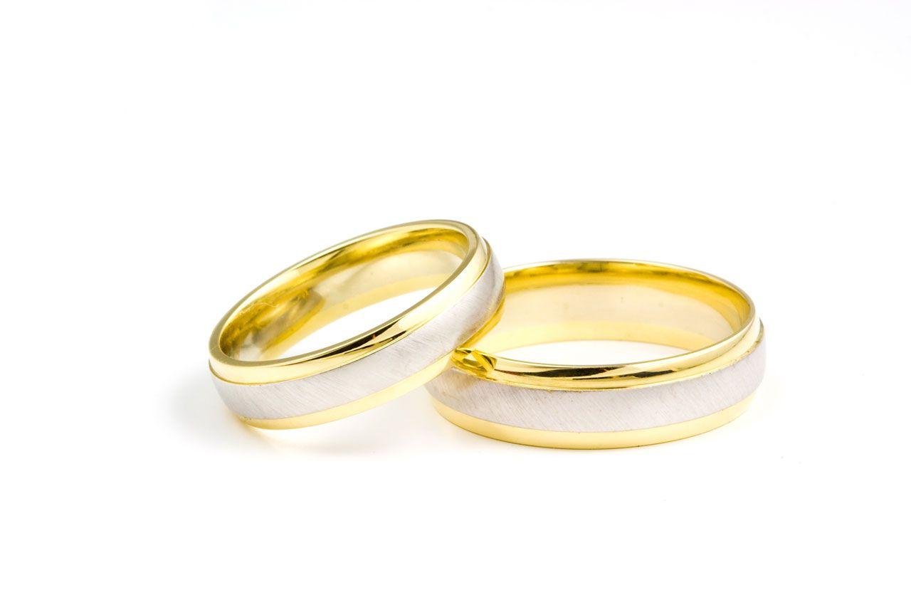 golden wedding rings on white