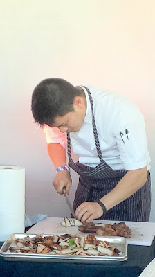 Careful knifework slicing at the station of Angus An of Maenam who presented Kor Moo Yang - Grilled Pork Jowl with Tamarind Dip for Night Market 2015