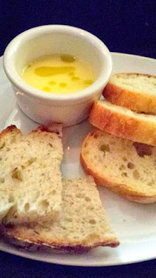 complimentary bread service at Aviary is wonderful as instead of just bread with butter, they offered a bagna cauda (butter, garlic, anchovies) for dipping the bread. Obviously because this has anchovies it's not vegetarian so if that's important to you, you'll have to pass on the dip. One of the two breads on the plate was an olive bread.