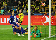 Julian Brandt scores Borussia Dortmund's first goal in their Uefa Champions League quarterfinal second leg match against Atletico Madrid at Signal Iduna Park in Dortmund, Germany on Tuesday night.