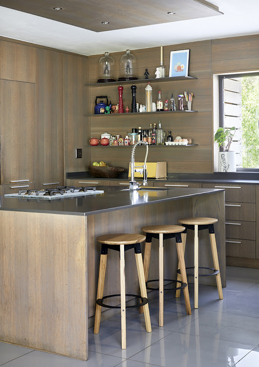 The wood and metal stools in the kitchen are by Pedersen & Lennard.