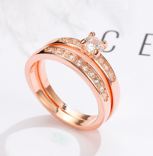 Title 5, Rose gold ring with diamonds, adding sparkle an...