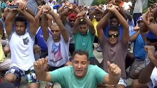 Asylum seekers protest possible closure of the detention centre on Manus Island, Papua New Guinea. Photo: Australia Broadcasting Company / Associated Press