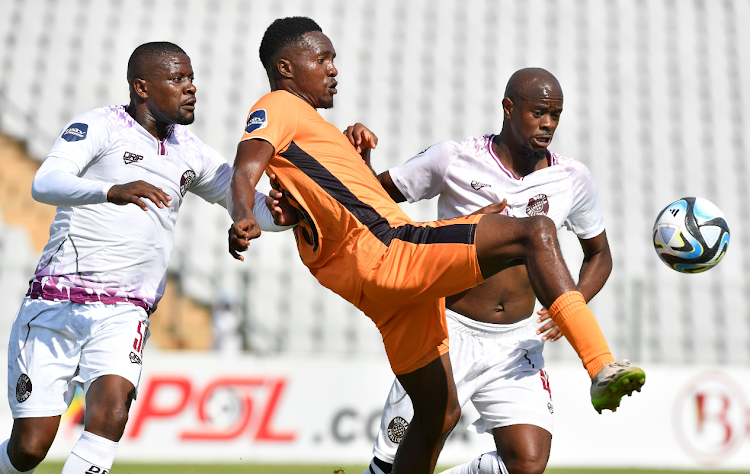 Douglas Mapfumo of Polokwane City challenges Kwanda Mngonyama of Morioka Swallows during DStv Premiership 2023/24 match at Dobsonville Stadium on on the 17 February 2024.