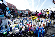 People gather around a makeshift memorial for Grammy-nominated rapper Nipsey Hussle who was shot and killed outside his clothing store in Los Angeles, California, US, April 1, 2019. 