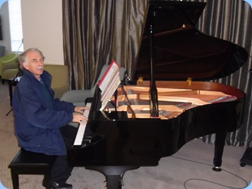 Claude Moffat playing the Yamaha mini-grand piano.