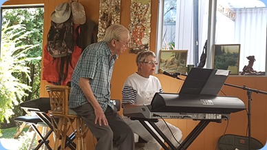 Gordon France singing along with Jeanette Harding.