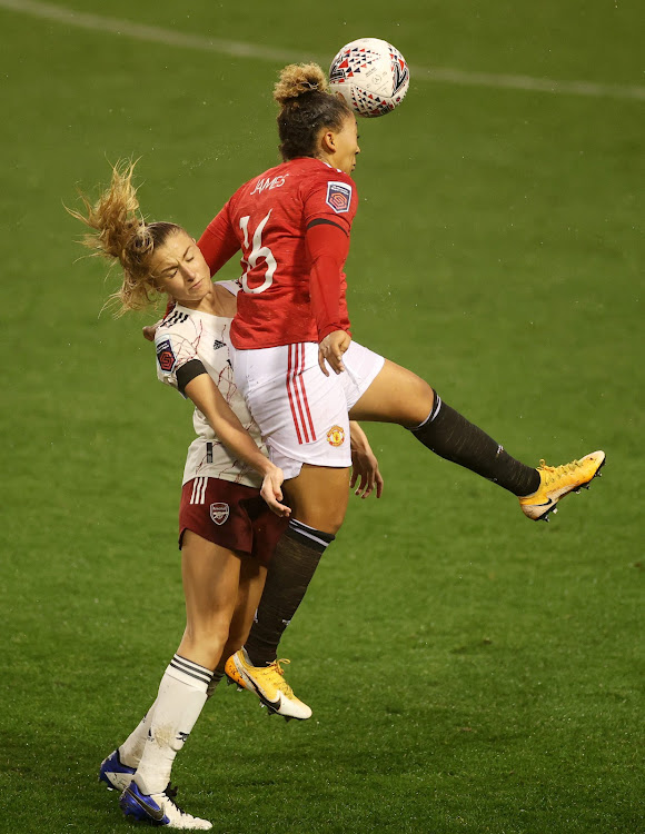 Arsenal's Leah Williamson in action with Manchester United’s Lauren James