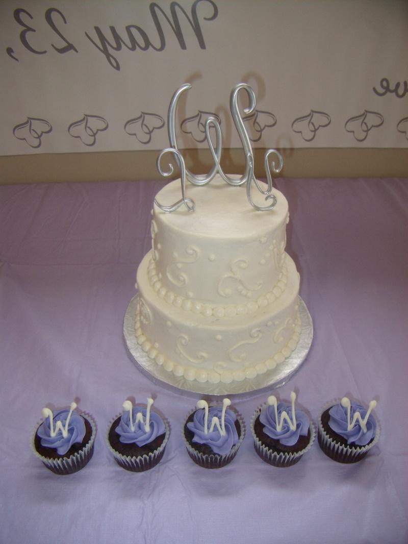 2 tiered pumpkin cake w cream cheese frosting. Scroll swirl design.