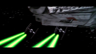 Two TIE fighters on attack, supported by a Star Destroyer