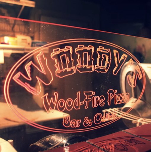 Woody's Wood-Fire Pizza Bar & Oven logo