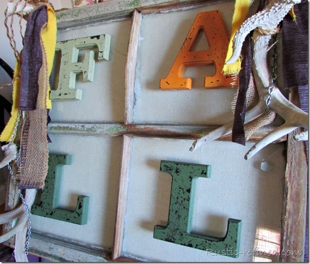 How to turn an Antique wood window into a beautiful piece of hanging art using rope, antlers, cup hooks, strips of fabric and galvanized metal chain.