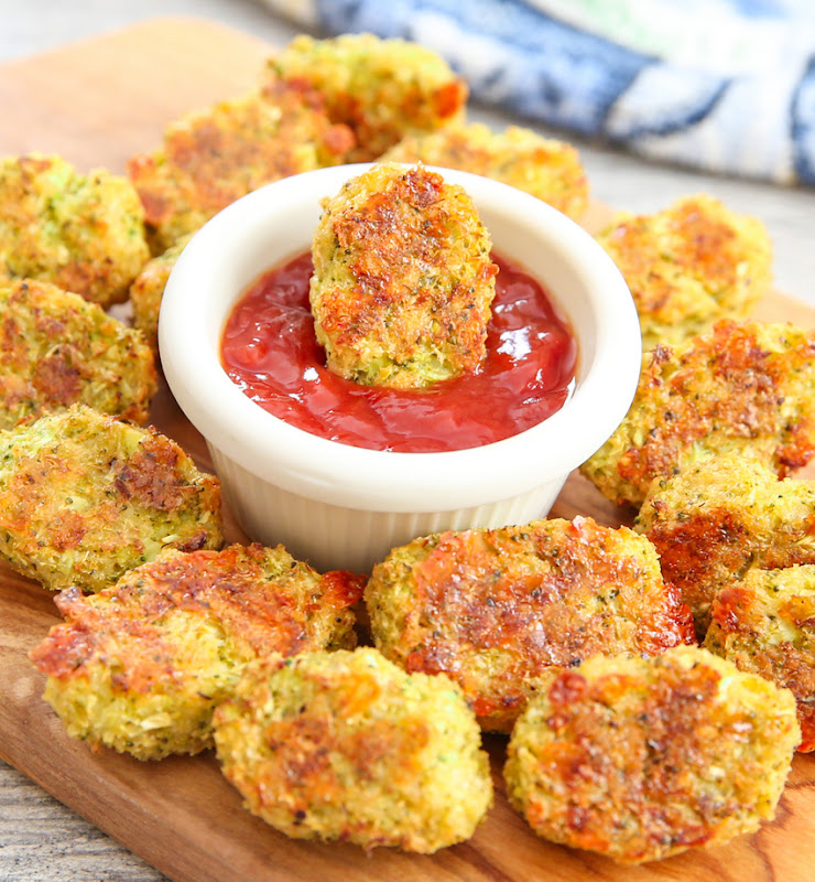 photo of a platter of Broccoli Tots with one tot being dipped in sauce