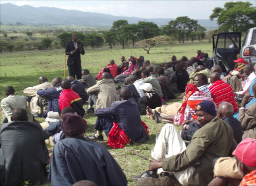 CROSSROADS: Keekonyokie land rights activist Daniel Tenaai addresses clan members in Kiserian last Friday. They are opposed to the sale of the land.