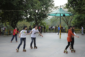 young people roller skating at Bailian Dong park in Zhuhai China