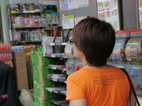 young woman wearing a shirt with the message "This is me This is who I am I've finally learned to LOVE myself. Wohooo"