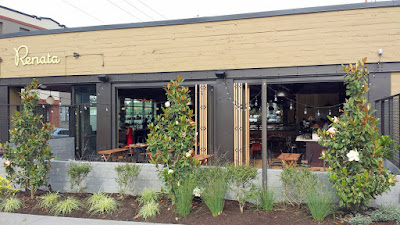 Renata patio to restaurant interior, bridged by the wide open sliding window/doors