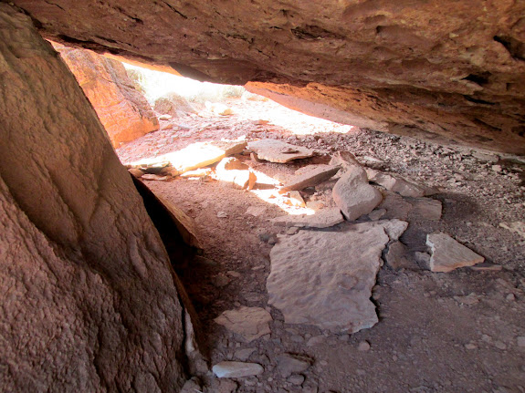 Shelter under the petroglyph boulder