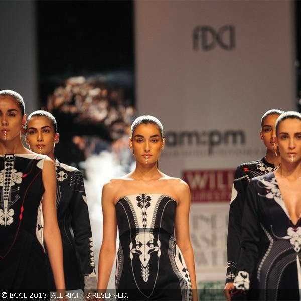 Former Miss India Kanishtha Dhankar walks the ramp for fashion designers Ankur Modi and Priyanka Modi on Day 2 of the Wills Lifestyle India Fashion Week (WIFW) Spring/Summer 2014, held in Delhi. 