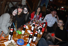 several people drinking while dressed up for Halloween in Changsha, China