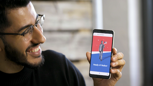 Man looking at a phone and app screen.