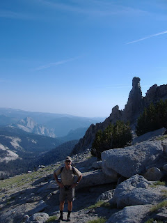 P at the base of the summit dome, with Half Dome in the background.