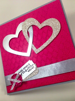 Linda Vich Creates: Hugs, Kisses and Valentine Wishes. Traditional Stampin' Up! Valentine card with two intertwined silver hearts, nestled on a Fancy Fan embossed matte, finished off with silver ribbons, button and sentiment stamped on a silver ticket.