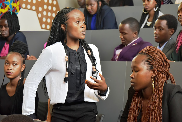 Joyce Nyawira, a beneficiary, addresses her fellow students at M-Pesa Foundation Academy in Thika on Monday.