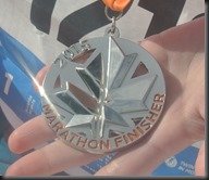 And shows off the medal.