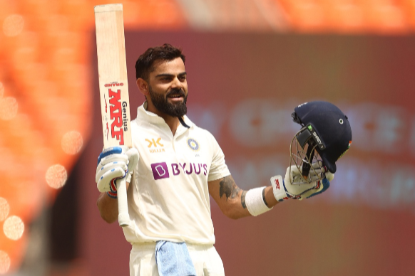 Virat Kohli of India celebrates after scoring his century during day four of the fourth Test match in the series against Australia at Narendra Modi Stadium on March 12 2023 in Ahmedabad, India.