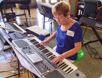 Diane Lyons, the Club's Events Manager, playing her Korg Pa900.