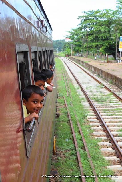 Local Kids enjoy the views during the train ride to Nanu Oya