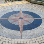 compass on the street in Yokohama, Japan 