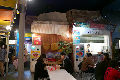 All around the Momofuku Ando Instant Ramen Museum Noodles Bazaar eating area are multiple booths with various kinds of ramen from around the world to try in a setting like an outdoor food court market