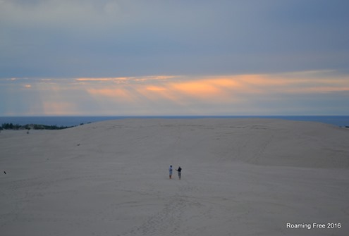 Tom and Dan walking across the dunes