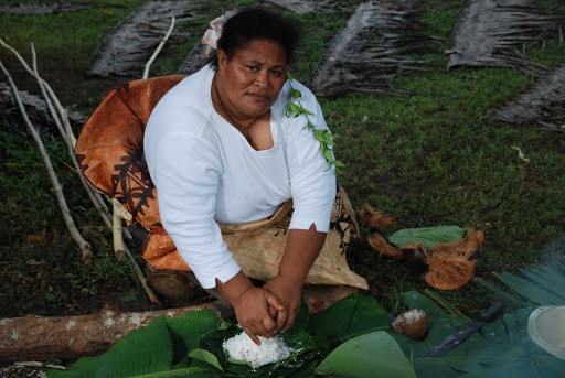 Tonga-woman.jpg - Chat up a local resident and try some fresh coconut, freshly scraped from the shell.