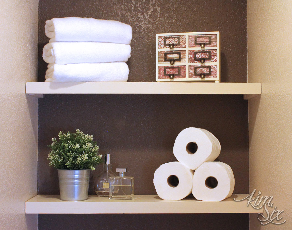 Wall to wall floating shelves in bathroom