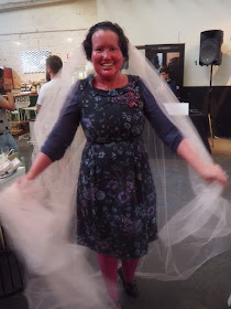 Carly Findlay trying on a wedding veil 