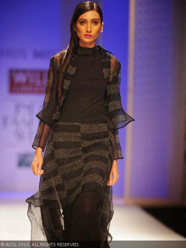 A model walks the ramp for fashion designer Rahul Mishra on Day 2 of the Wills Lifestyle India Fashion Week (WIFW) Spring/Summer 2014, held in Delhi.