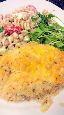 Cheddar Garlic Oven Baked Chicken Breast with gluten free pasta with cherry tomatoes and broccoli and microgreens and a touch of feta