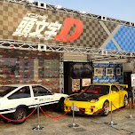 Initial D race cars and booth girls at a-nation in Shibuya in Shibuya, Japan 