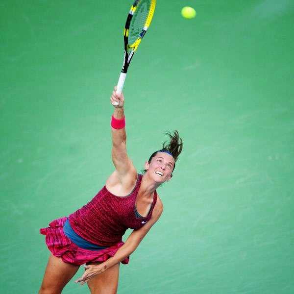 Italy's Roberta Vinci serves the ball to Denmark's Caroline Wozniacki during a WTA Istanbul Cup final tennis match on July 20, 2014 in Istanbul. Wozniacki won 6-1, 6-1. 